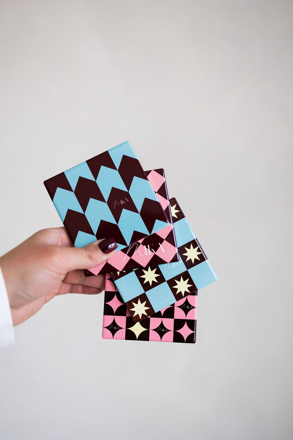 Holding the Mika Ceramic Coasters