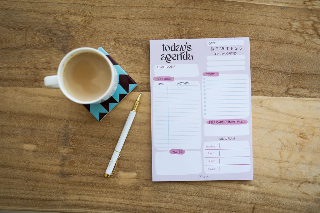 Today's Agenda Daily Notepad on a desk with coffee